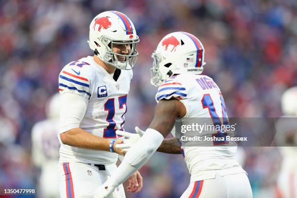 Josh Allen and Stefon Diggs of the Buffalo Bills celebrate after scoring a touchdown in the fourth quarter against the Miami Dolphins at Highmark...