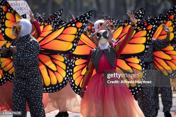 Group of dancers dressed as monarch butterflies perform a choreographic routine, during the annual Day of The Dead Parade on October 31, 2021 in...