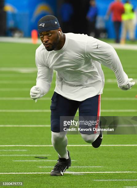 Josh Uche of the New England Patriots warms up before the game against the Los Angeles Chargers at SoFi Stadium on October 31, 2021 in Inglewood,...