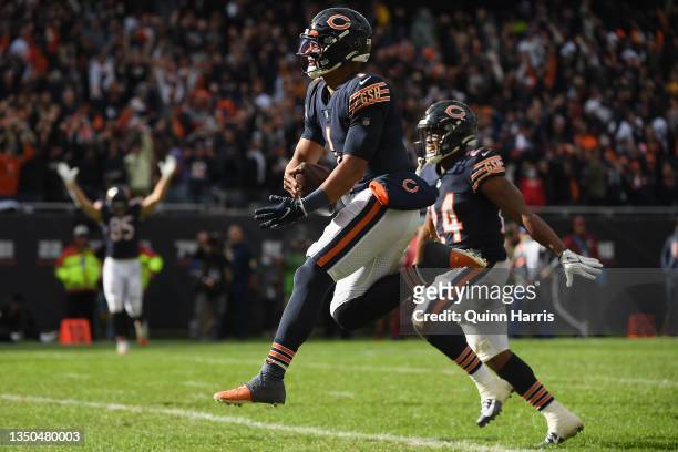 Justin Fields of the Chicago Bears celebrates after scoring a touchdown in the fourth quarter against the San Francisco 49ers at Soldier Field on...