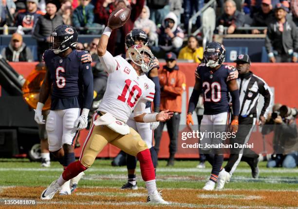 Jimmy Garoppolo of the San Francisco 49ers celebrates after scoring a touchdown in the fourth quarter against the Chicago Bears at Soldier Field on...