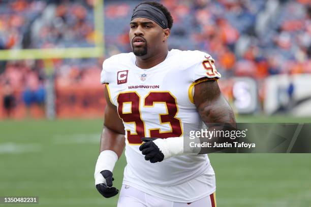 Jonathan Allen of the Washington Football Team warms up before the game against the Denver Broncos at Empower Field At Mile High on October 31, 2021...