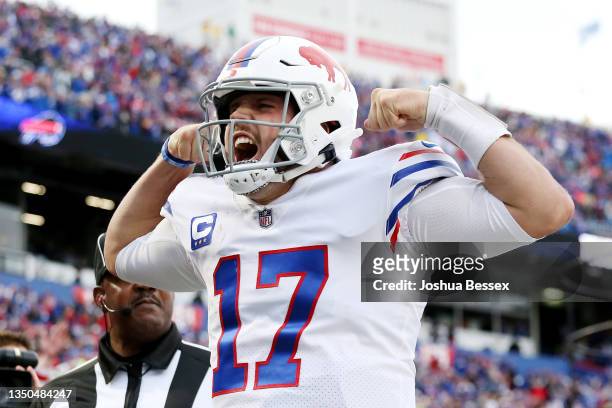Josh Allen of the Buffalo Bills celebrates after scoring a touchdown in the fourth quarter against the Miami Dolphins at Highmark Stadium on October...