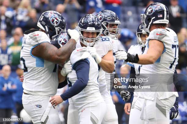 Randy Bullock of the Tennessee Titans celebrates with teammates after kicking the game winning field goal during overtime against the Indianapolis...