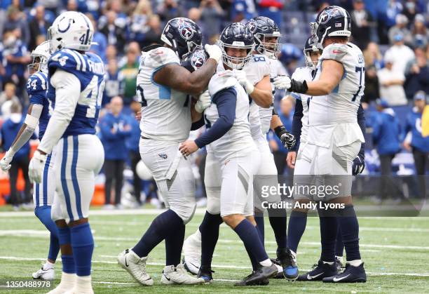 Randy Bullock of the Tennessee Titans celebrates with teammates after kicking the game winning field goal during overtime against the Indianapolis...