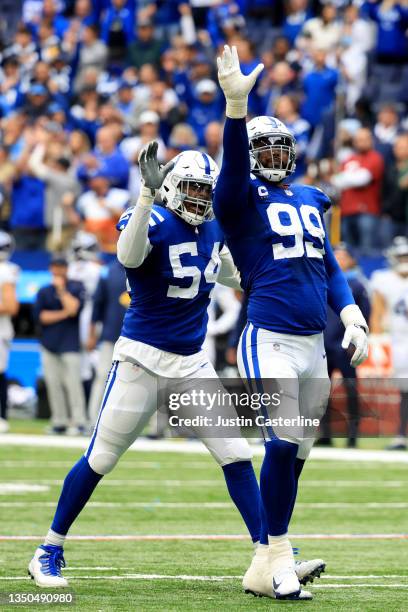 Dayo Odeyingbo and DeForest Buckner of the Indianapolis Colts celebrate a sack in the second half against the Tennessee Titans at Lucas Oil Stadium...