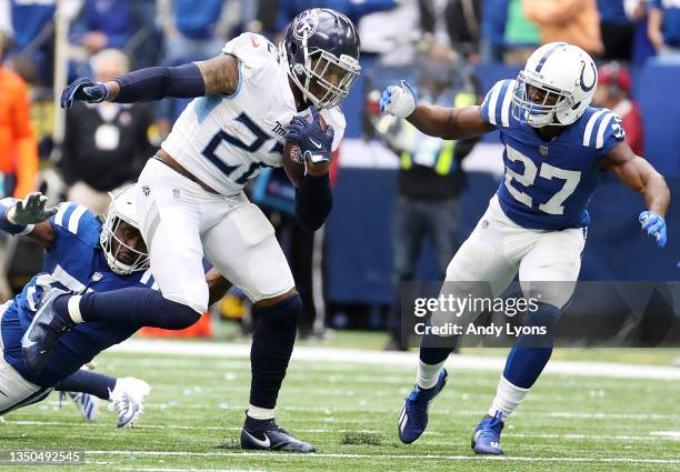 Derrick Henry of the Tennessee Titans carries the ball against Xavier Rhodes of the Indianapolis Colts in the second half at Lucas Oil Stadium on...