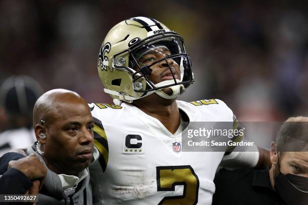 Jameis Winston of the New Orleans Saints is taken off the field after an injury during the second quarter against the Tampa Bay Buccaneers at Caesars...