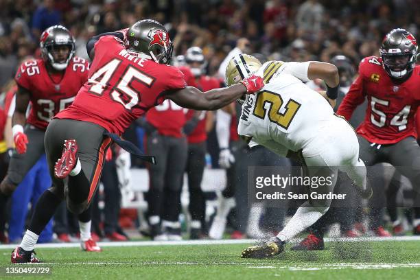 Jameis Winston of the New Orleans Saints is injured after being tackled by Devin White of the Tampa Bay Buccaneers during the second quarter at...