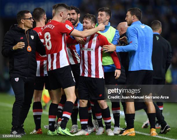 Iker Muniain of Athletic Bilbao celebrates with team mates after scoring their side's first goal during the La Liga Santander match between Real...