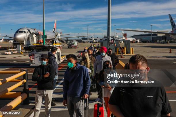 Domestic travelers from New South Wales disembark the plane at Melbourne Airport on November 01, 2021 in Melbourne, Australia. Domestic flights...