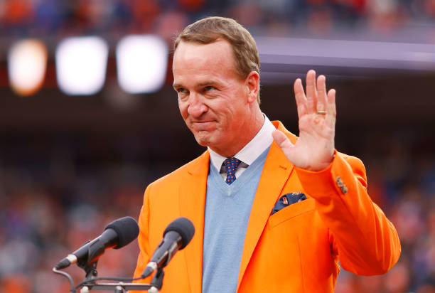 Peyton Manning speaks to the crowd during a Ring of Honor induction ceremony at halftime of the game between the Washington Football Team and Denver...