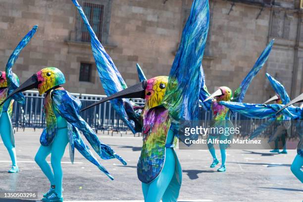 Group of dancers dressed as hummingbirds perform their choreographic routine, during the annual "Desfile del día de muertos" on October 31, 2021 in...
