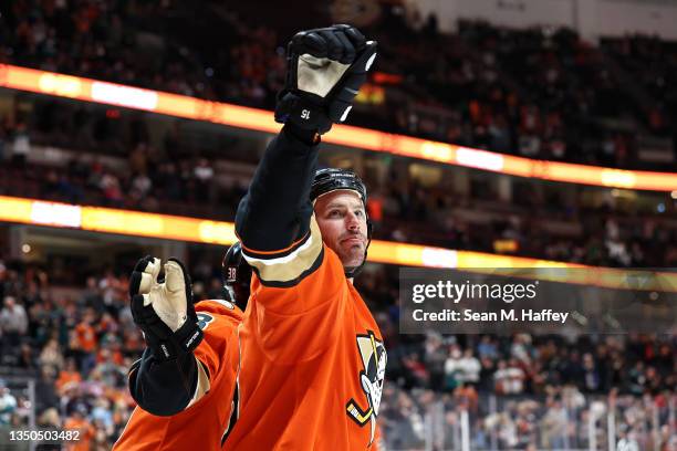 Ryan Getzlaf waves to the crowd after an assist on a goal scored by Troy Terry of the Anaheim Ducks during the third period of a game against the...