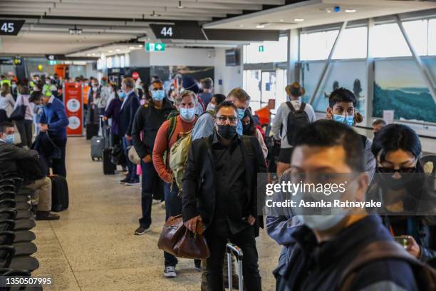 Domestic travelers are seen lined up to depart Melbourne Airport on November 01, 2021 in Melbourne, Australia. Domestic flights between New South...