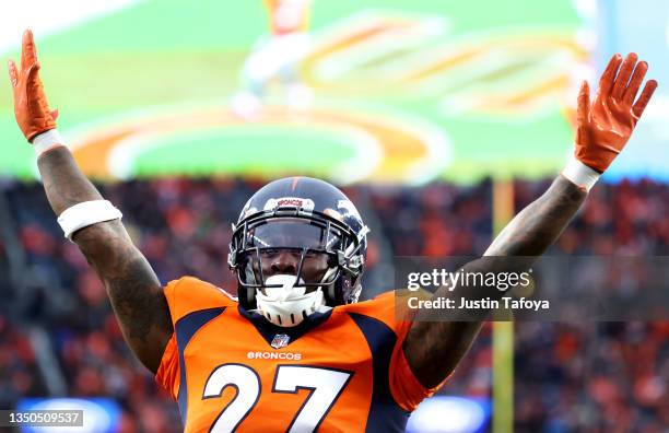 Nate Hairston of the Denver Broncos celebrates in the fourth quarter against the Washington Football Team at Empower Field At Mile High on October...