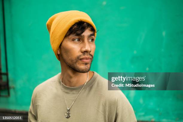 portrait of a young latin man looking away - nosotroscollection bildbanksfoton och bilder