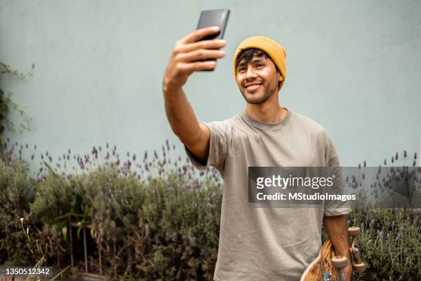 selfie time! - cool guy in hat stock pictures, royalty-free photos & images