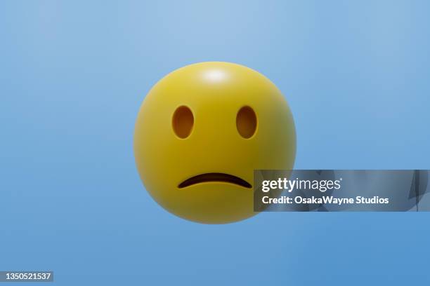 round yellow frowning face, sad emoticon - emoji stock-fotos und bilder