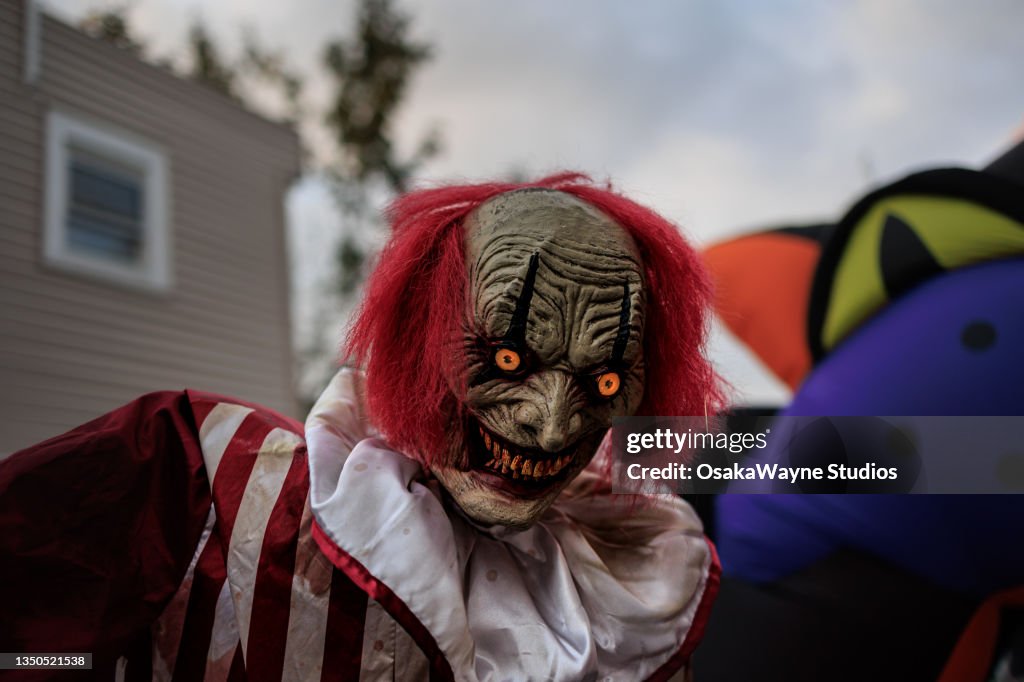 Halloween costume with spooky creature mask