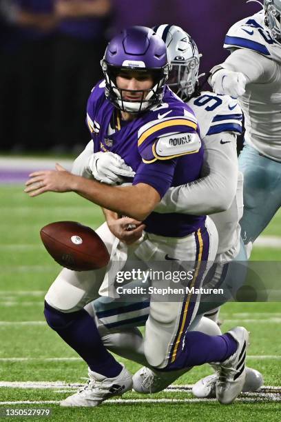 Randy Gregory of the Dallas Cowboys forces Kirk Cousins of the Minnesota Vikings to fumble during the third quarter at U.S. Bank Stadium on October...