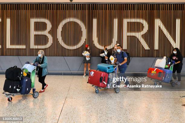 Recently arrived international travellers walk through the Melbourne Airport International arrivals hall on November 01, 2021 in Melbourne,...