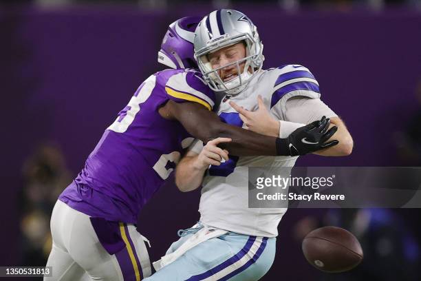 Xavier Woods of the Minnesota Vikings sacks and forces Cooper Rush of the Dallas Cowboys to fumble during the fourth quarter at U.S. Bank Stadium on...