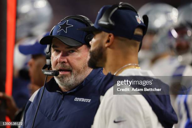 Head coach Mike McCarthy of the Dallas Cowboys talks with Dak Prescott against the Minnesota Vikings during the second half at U.S. Bank Stadium on...