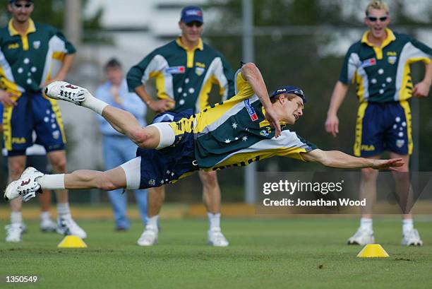 Shane Watson of Australia dives for the ball during a team training session held today at the Allan Border Oval in Brisbane, Australia on August 23,...