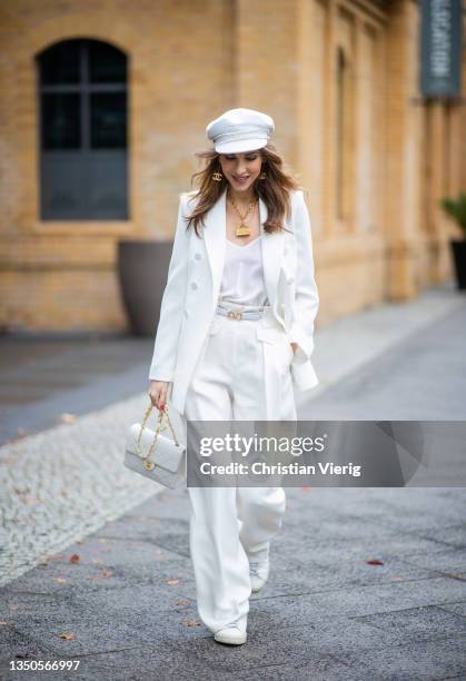 Alexandra Lapp is seen wearing Pants - high waist, wide leg pants from Giorgio Armani, Blazer - Zara, Bag - Chanel Vintage classic Flap-bagin white...
