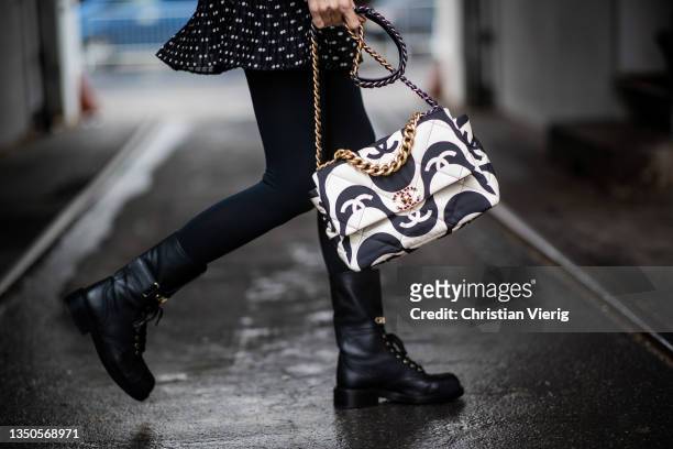 Alexandra Lapp is seen wearing black white sheer Dress - Zara, Boots - Chanel , black white two tone Bag - Chanel19, Stockings - Falke, Beret - Zara...