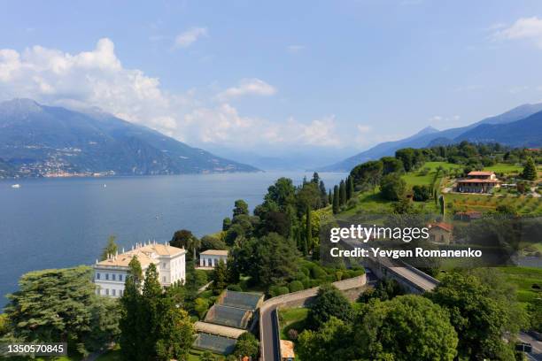 beautiful aerial view of mountains and lake como in bellagio, italy - bellagio stockfoto's en -beelden