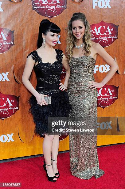 Recording artists Susie Brown and Danelle Leverett of The JaneDear Girls arrive for the American Country Awards at the MGM Grand Garden Arena on...