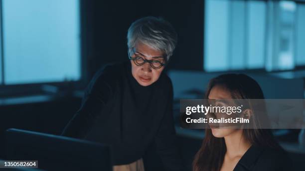 office workers working late together - emotional series stock pictures, royalty-free photos & images