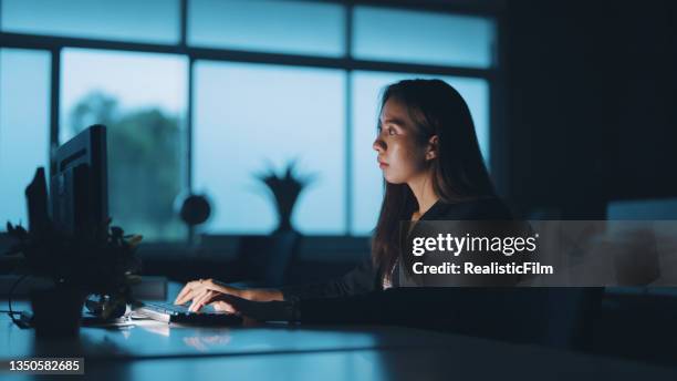 asian businesswoman working late at night - assault stock pictures, royalty-free photos & images