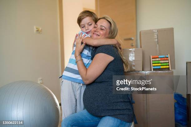 pregnant woman and her son in new room for coming baby - embracing change stock pictures, royalty-free photos & images