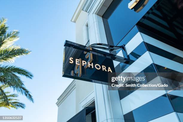 Sign on facade of Sephora cosmetics store with palm tree in background in Concord, California, October 14, 2021.