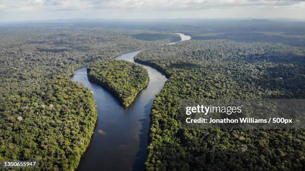 aerial view of river amidst landscape against sky,guyana - guyana stock pictures, royalty-free photos & images