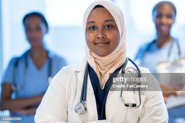 muslim doctor portrait - islam religion stock pictures, royalty-free photos & images