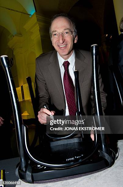 Nobel Prize in Physics laureate Saul Perlmutter of the United States signs on December 6, 2011 a chair at the Nobel museum in Stockholm. Since 2001,...