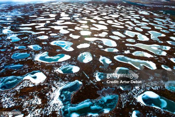 surreal volcanic formations with frozen pools in the north of iceland. - naturwunder stock-fotos und bilder