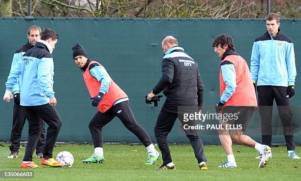 Manchester City's Argentinian forward Sergio Aguero takes part in a training session in Manchester on December 6, 2011 on the eve of their UEFA...