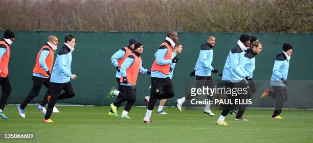 Manchester City players take part in a training session in Manchester on December 6, 2011 on the eve of their UEFA Champions League group A football...