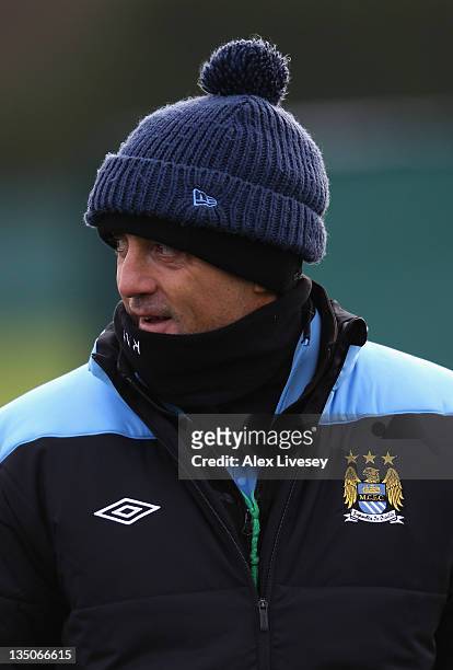 Roberto Mancini the manager of Manchester City looks on during a training session ahead of their UEFA Champions League Group A match against Bayern...