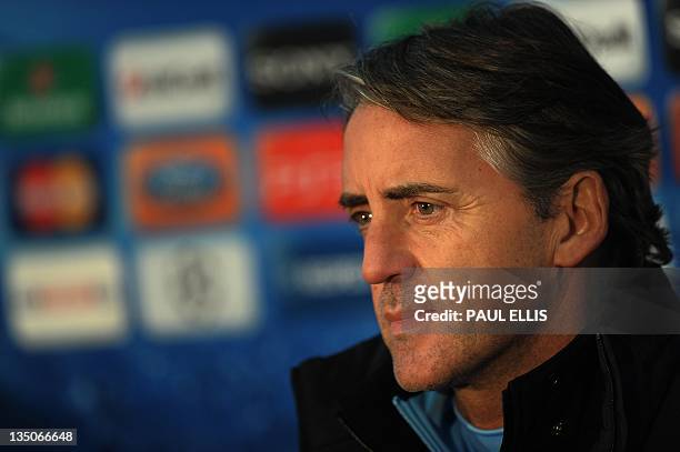 Manchester City's Italian manager Roberto Mancini attends a press conference in Manchester on December 6, 2011 on the eve of their UEFA Champions...