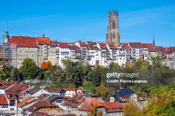medieval old town of fribourg and the lower town, and saint nicolas cathedral above - freiburg skyline stock pictures, royalty-free photos & images