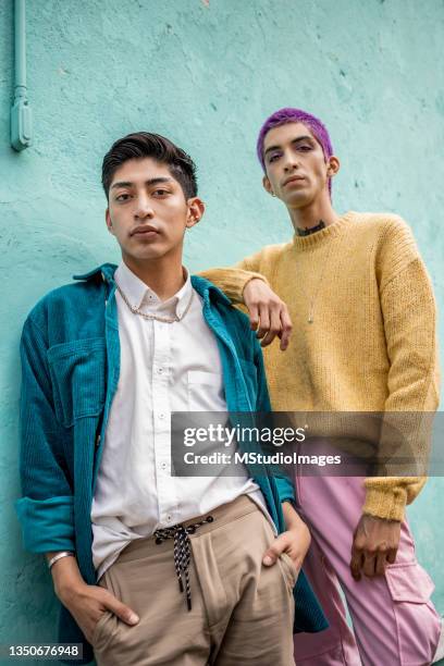 low angle photo of two young man - fashion young man stockfoto's en -beelden