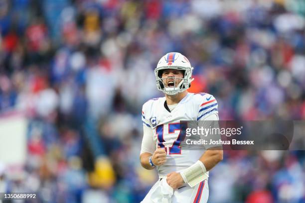 Josh Allen of the Buffalo Bills celebrates after a touchdown run during the fourth quarter against the Miami Dolphins at Highmark Stadium on October...