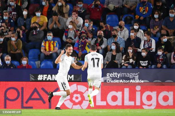 German Sanchez of Granada CF celebrates with Quini Marin after scoring their team's first goal during the La Liga Santander match between Levante UD...
