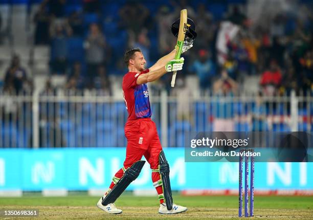 Jos Buttler of England celebrates reaching his century during the ICC Men's T20 World Cup match between England and Sri Lanka at Sharjah Cricket...